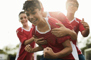 Children playing sport and children in a classroom images