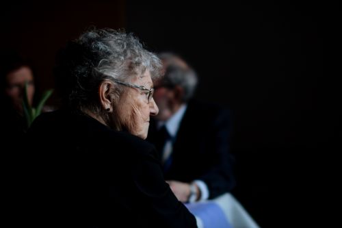 Thoughtful elderly woman gazing into space