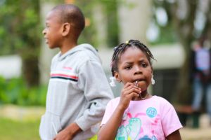 Young boy in grey top and young girl in pink t-shirt