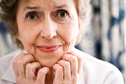 Elderly woman looking confused