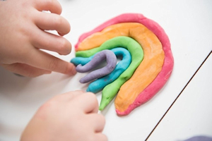 Hands playing with playdough Hands playing with playdough