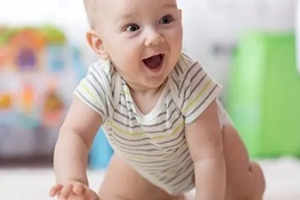 Baby in stripy baby grow