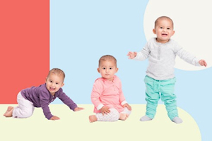 Three babies crawling to standing