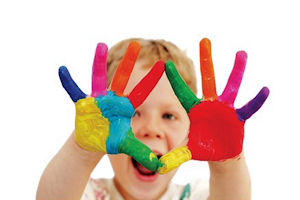 Young child with multi-coloured painted hands