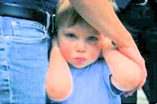 Shy child pulling a face