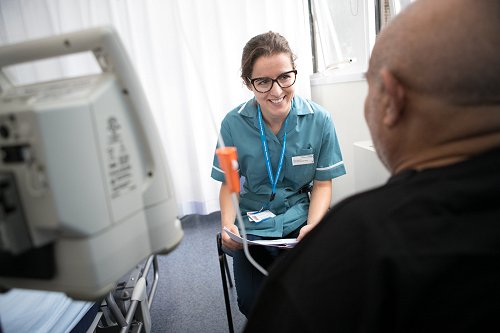 Specialist nurse with patient