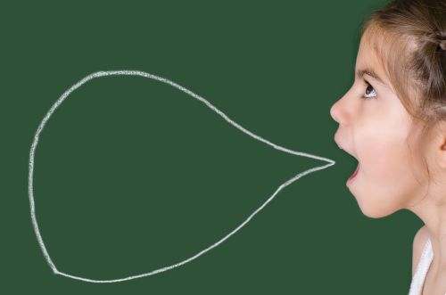 Girl with white chalk speech bubble