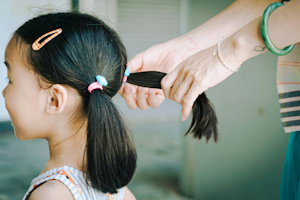 Young girl with hair in plaits
