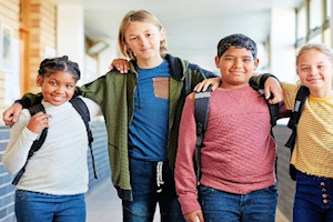 Four children standing in a row