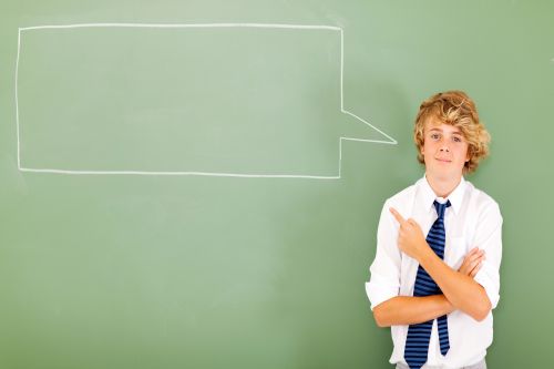 Boy pointing to white rectangle speech bubble