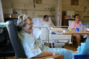 Old lady sitting in a chair smiling Old lady sitting in a chair smiling