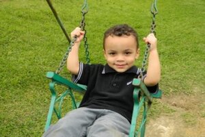 Young boy on a swing
