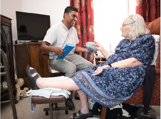 A photo of a clinician and a patient