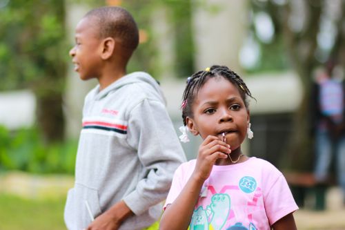 Young boy in grey top and young girl in pink t-shirt Young boy in grey top and young girl in pink t-shirt